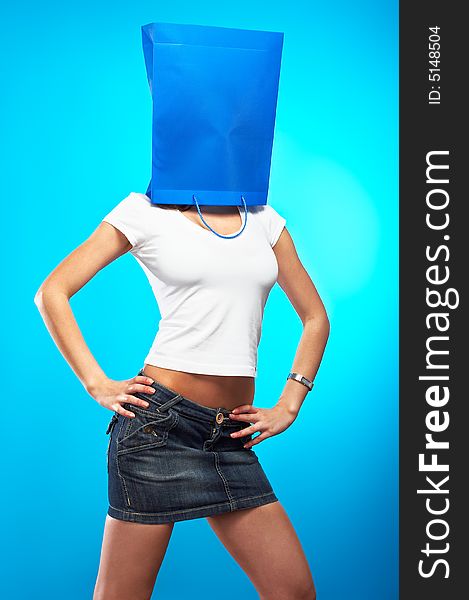 Shopping metaphor, woman with shopping bag over her head