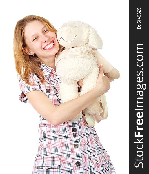 Happy girl with toy sheep over white