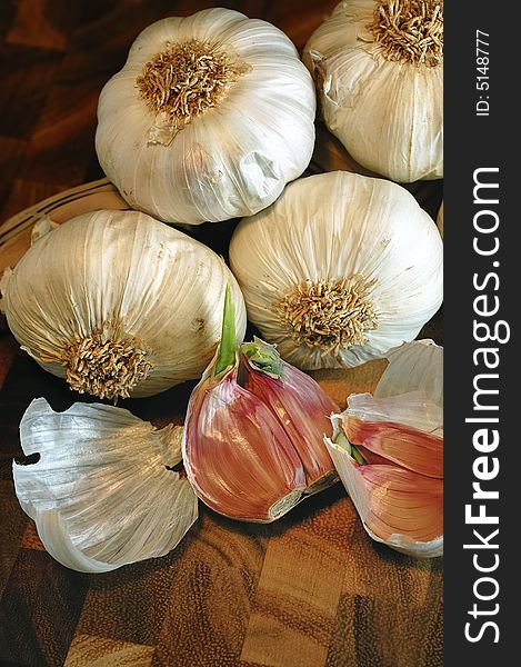 Garlic on a cutting board. Warm light and detail on the chopped slices