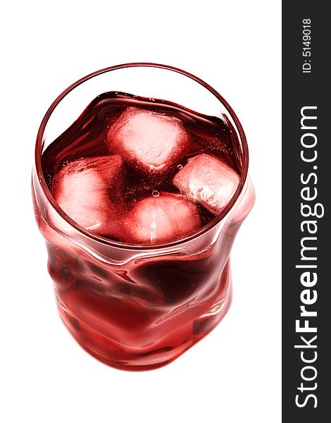 Glass with a cocktail and an ice on a white background
