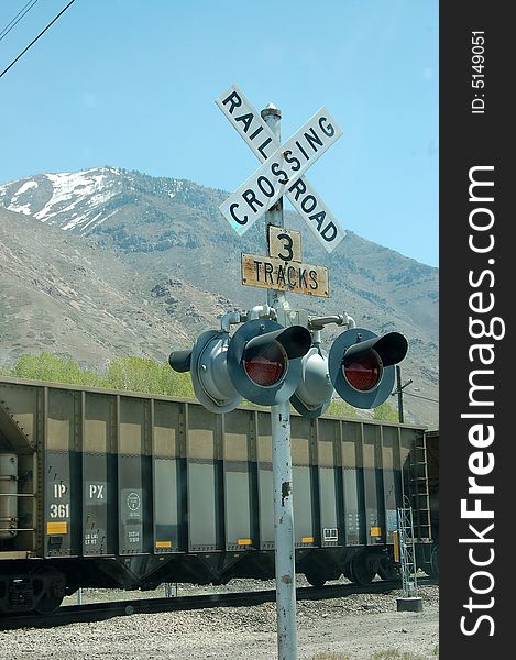 Train crossing , cars waiting for train to pass by.
three tracks to cross.  nice clear day. Train crossing , cars waiting for train to pass by.
three tracks to cross.  nice clear day