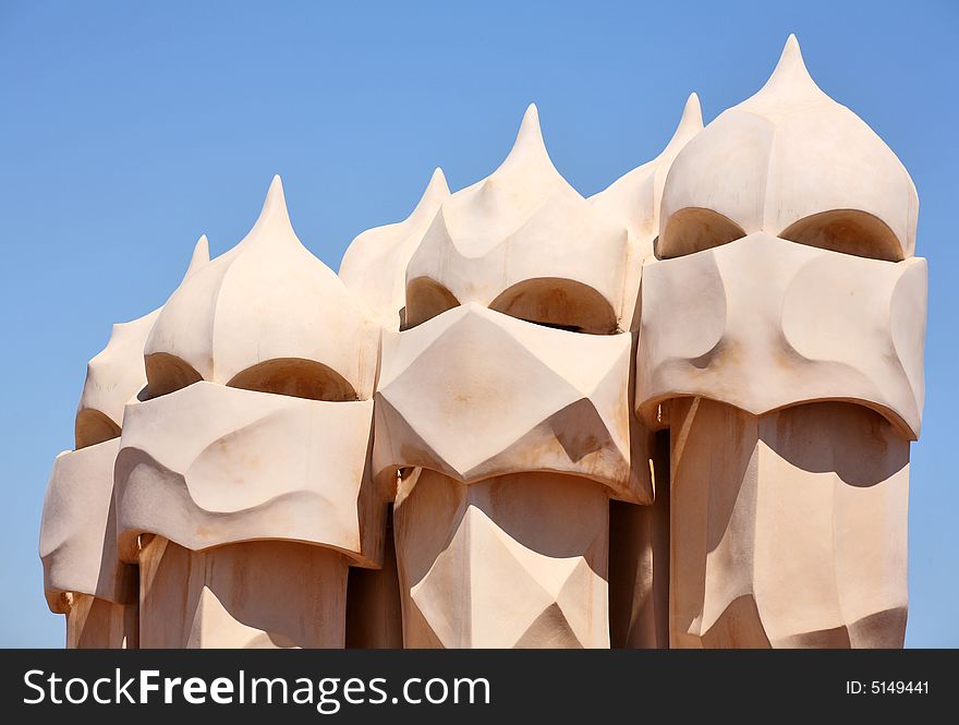 An abstract sculptures on the roof La Pedrera (MilÃ  House) in Barcelona, Spain created by Antonio Gaudi. These sculptures are the chimneys of the apartment building