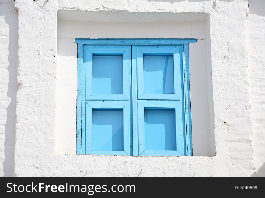 Blue window (window blinds on traditional Mediterranean house)