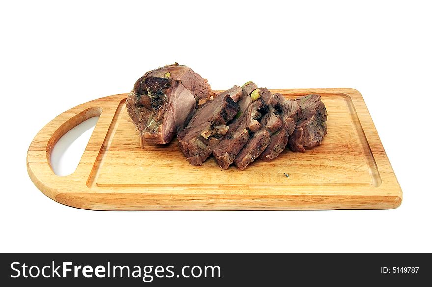 Appetizing boiled pork on a chopping board, cut on slices