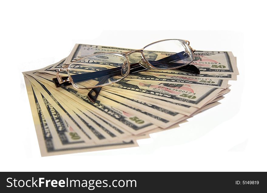 Lot of money from banknotes on 50 dollars and glasses. Lot of money from banknotes on 50 dollars and glasses