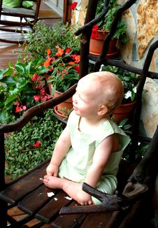 Baby With Flowers On Porch Royalty Free Stock Image Baby With Flowers On Porch Royalty Free Stock Image