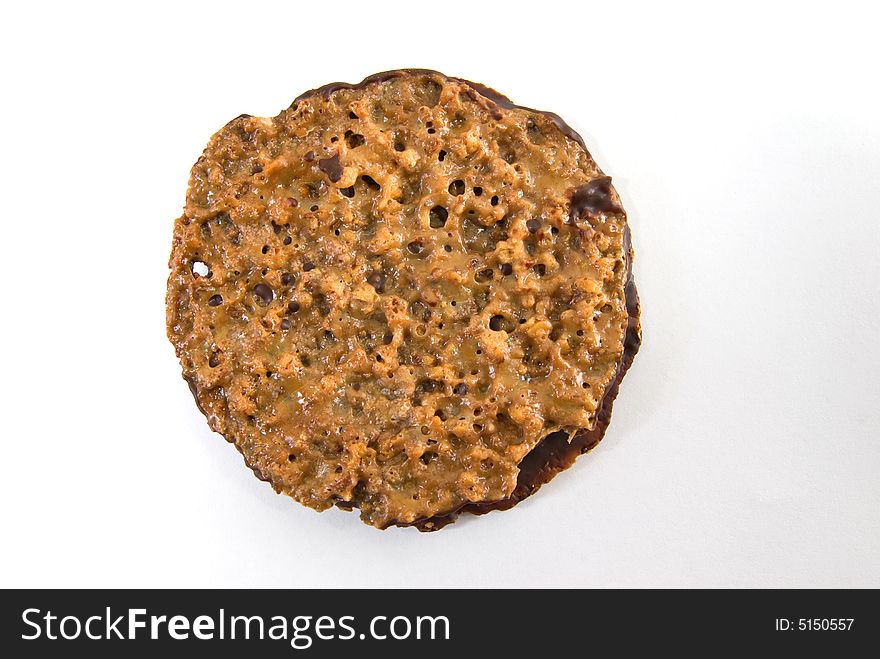 Crisp toffee wafer cookie sandwiched with dark chocolate - isolated on white. Crisp toffee wafer cookie sandwiched with dark chocolate - isolated on white