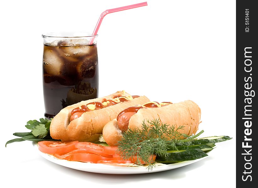 Hot dogs with vegetables and a glass of cola with ice isolated on a white background