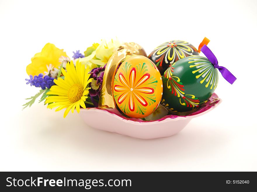 Easter basket with eggs and spring flowers