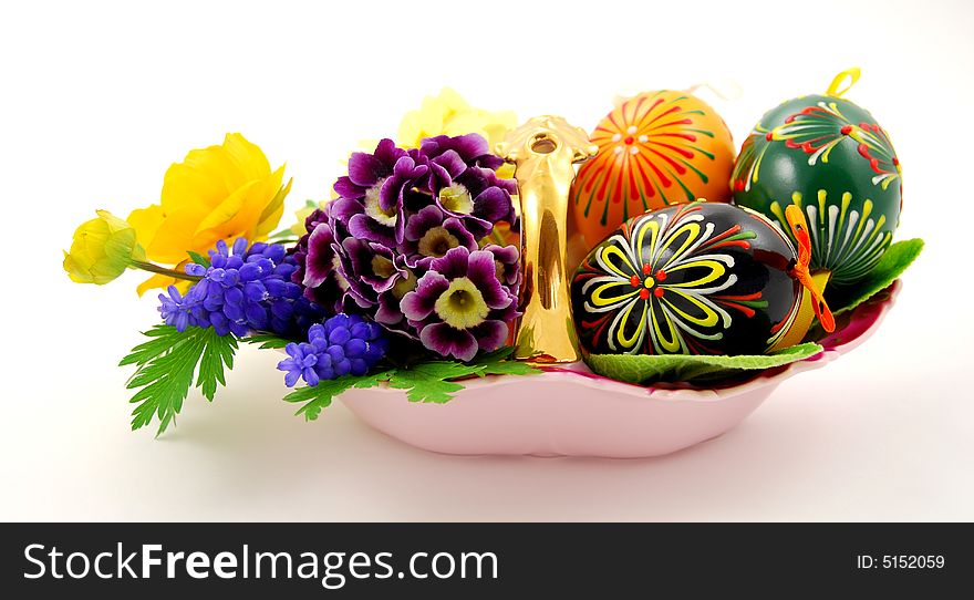 Porcelain basket with easter eggs and spring flowers