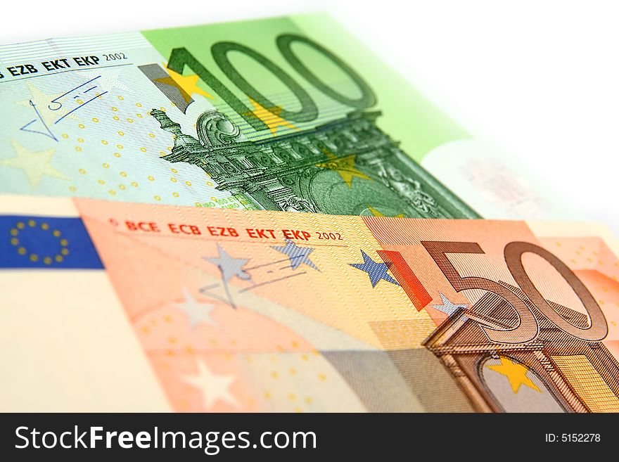 A few euro bills on a white background