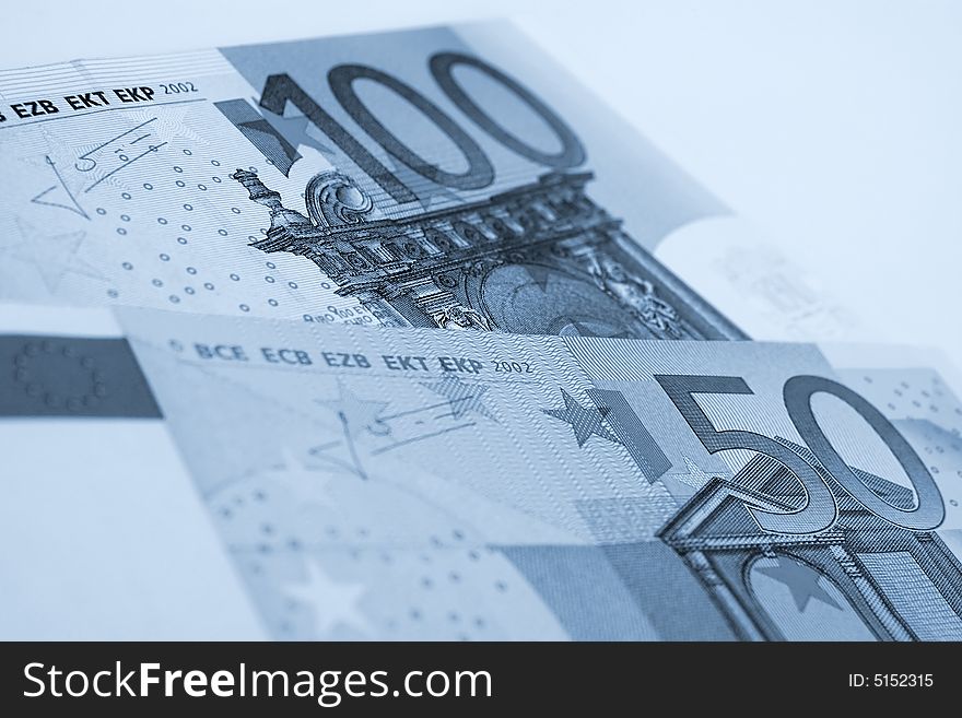 A few euro bills on a white background