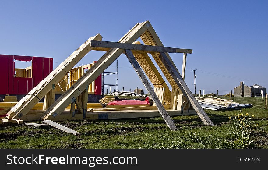 Roof Timbers in a Building yard. A timber roof truss is a structural framework of timbers designed to bridge the space above a room and to provide support for a roof.. The space between each truss is known as a bay. Rafters have a tendency to flatten under gravity, thrusting outwards on the walls. Ridge: The highest point of a pitched roof that receives the head of the spars &#x28;also called rafters or common rafters&#x29;. The table states that 2 X 6 rafters spaced 16 inches on centre &#x28;o.c&#x29; can span a maximum distance of 13 feet 5 inches. Another option is 2 X 8 rafters spaced 24 inches. . Roof Timbers in a Building yard. A timber roof truss is a structural framework of timbers designed to bridge the space above a room and to provide support for a roof.. The space between each truss is known as a bay. Rafters have a tendency to flatten under gravity, thrusting outwards on the walls. Ridge: The highest point of a pitched roof that receives the head of the spars &#x28;also called rafters or common rafters&#x29;. The table states that 2 X 6 rafters spaced 16 inches on centre &#x28;o.c&#x29; can span a maximum distance of 13 feet 5 inches. Another option is 2 X 8 rafters spaced 24 inches.