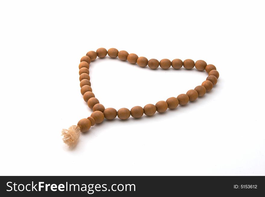 Necklace from a juniper on a white background