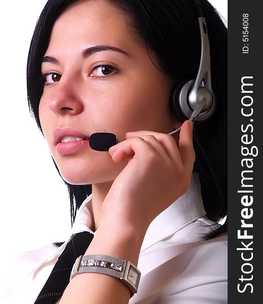 A portrait about a young pretty customer service representative lady with black hair who smiles, she has a headphone, and she wears a white shirt and a black tie