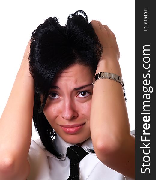 A portrait about a young pretty businesswoman with black hair who has a headache because of the hard work and she is holding her head. She is wearing a white shirt and a black tie. A portrait about a young pretty businesswoman with black hair who has a headache because of the hard work and she is holding her head. She is wearing a white shirt and a black tie.