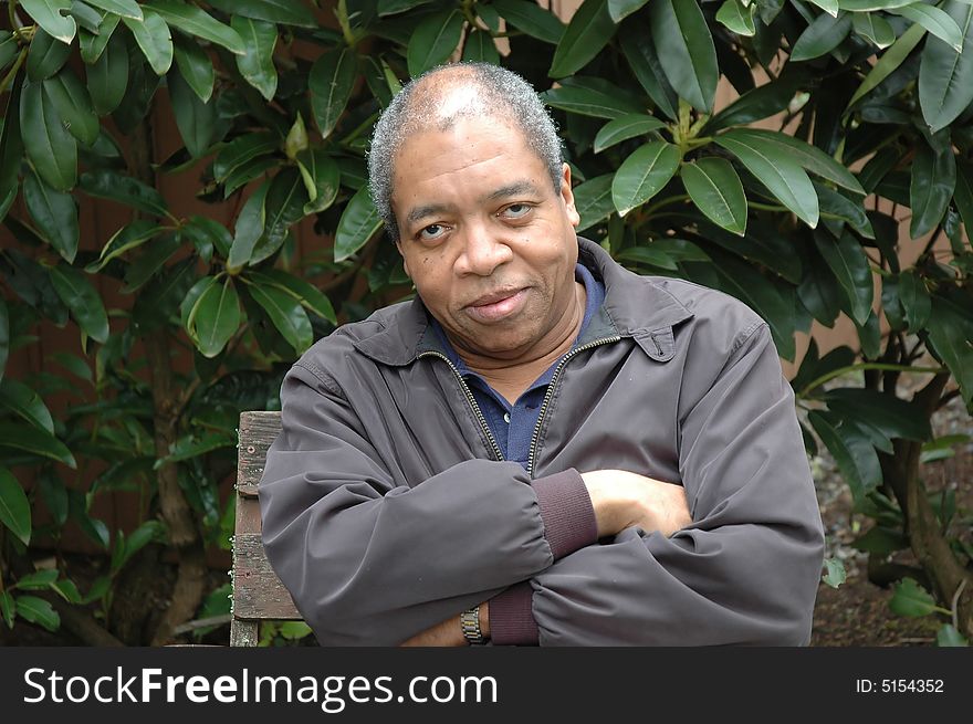 African american male relaxing at home on his patio deck.