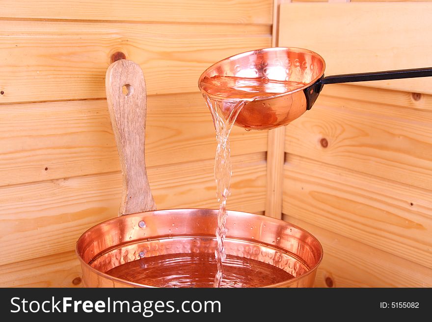 Bucket with water inside a Finnish sauna. Bucket with water inside a Finnish sauna