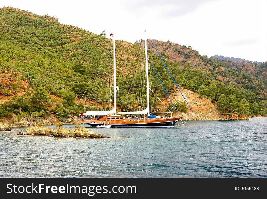 Beautiful marine landscape with yacht in bay