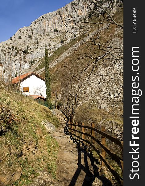 Path towards a house in mountains. Path towards a house in mountains