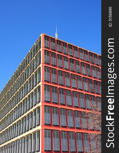 Colorful office building against blue sky