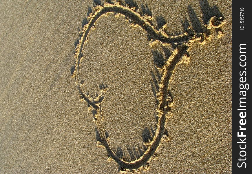 A heart drawn on the beach sand. A heart drawn on the beach sand