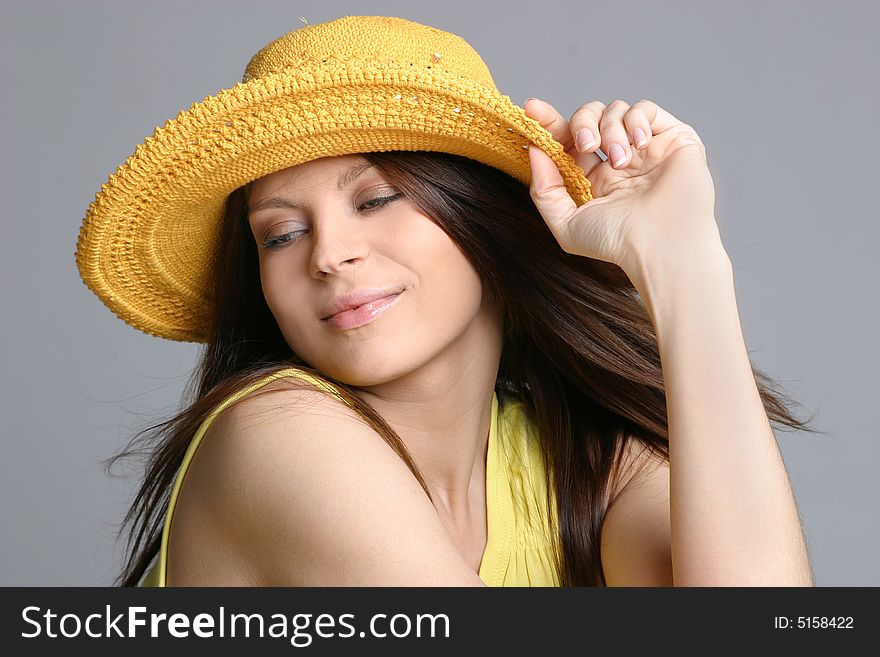 Beautiful sexy woman in yellow hat.