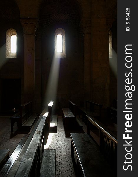 Sun shining through the window of a deserted abbey. Sun shining through the window of a deserted abbey