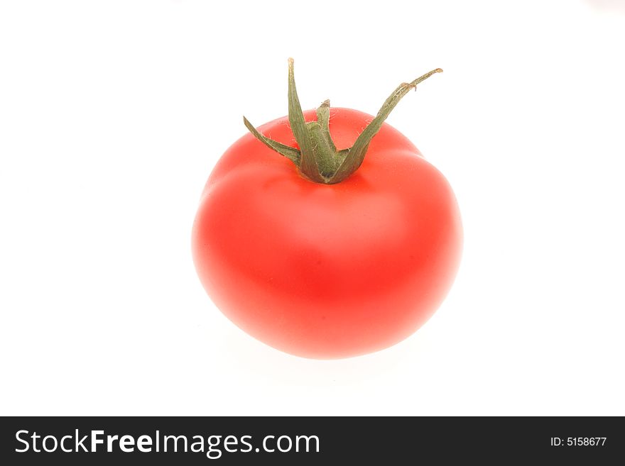 Single ripe tomato isolated on a white background. Single ripe tomato isolated on a white background