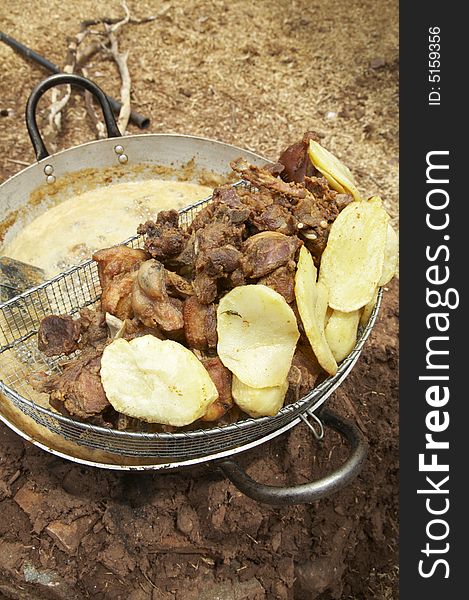 Chicharron, deep fried pork, and potatoes in the Peruvian Andes. Chicharron, deep fried pork, and potatoes in the Peruvian Andes.