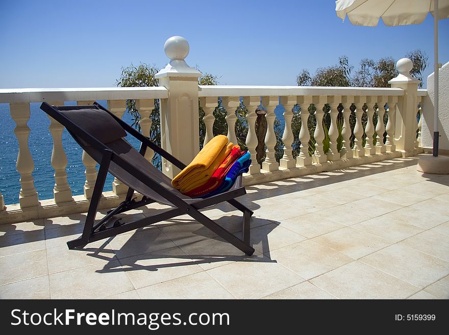 Colorful summer towels on a hotel balcony. Colorful summer towels on a hotel balcony