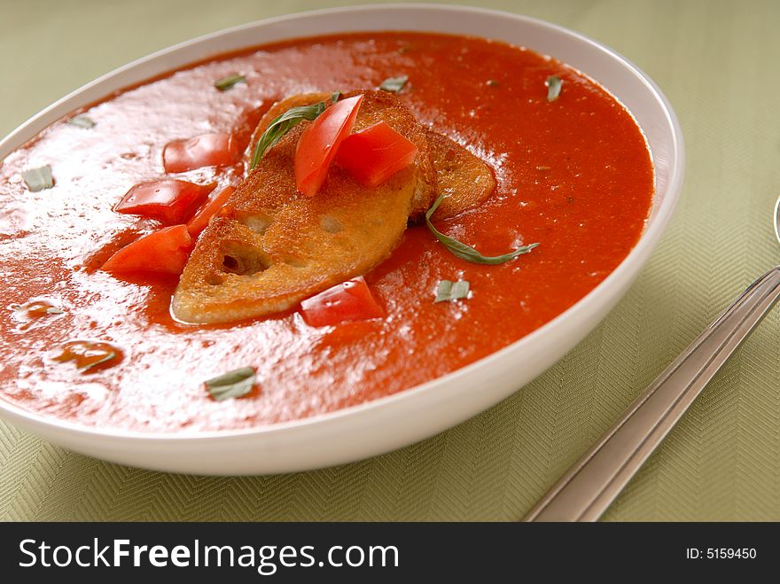 A hearty nutritious tomato soup with crostini, basil and tarragon. A hearty nutritious tomato soup with crostini, basil and tarragon