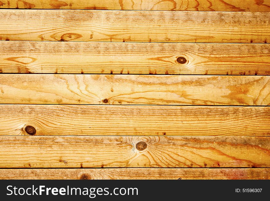 Wall of yellow wooden planks as background. Wall of yellow wooden planks as background