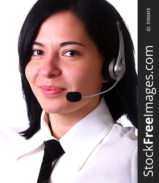 A portrait about a young pretty customer service representative lady with black hair who is smiling, she has a headphone, and she is wearing a white shirt and a black tie