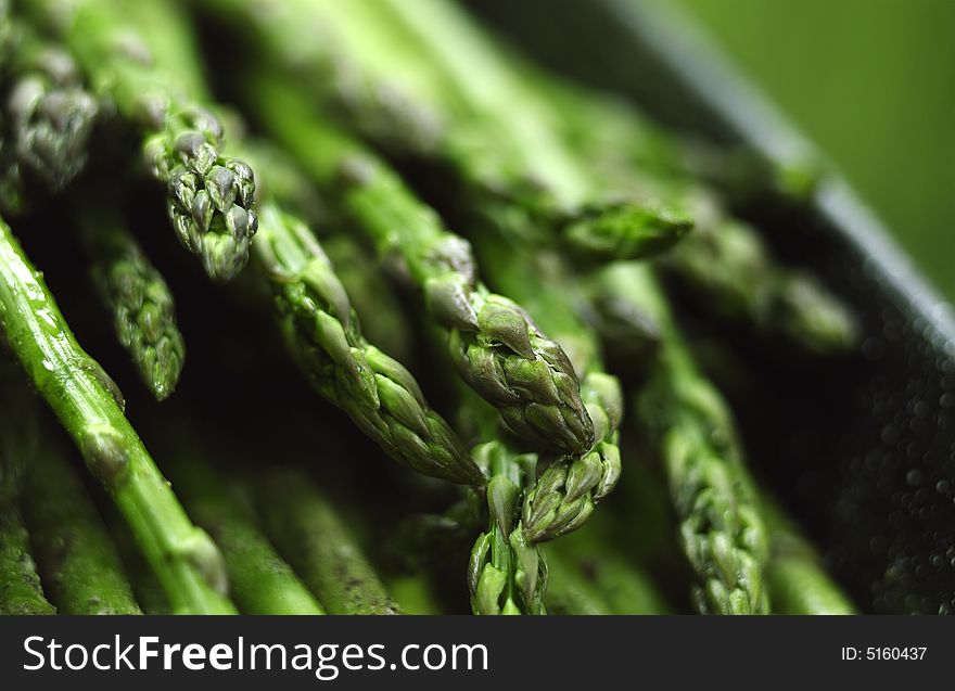 Pan filled with asparagus ready for grilling. Pan filled with asparagus ready for grilling.