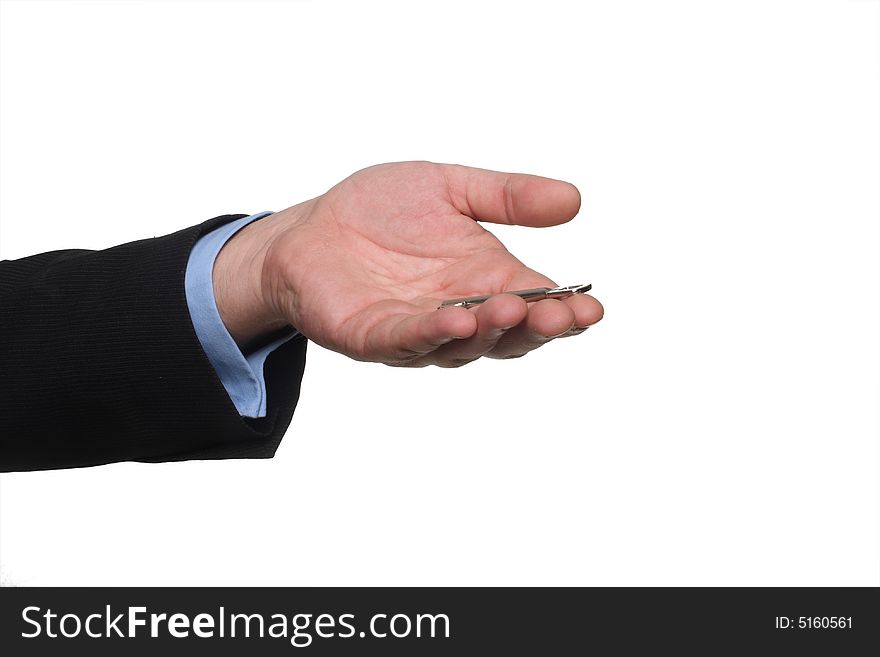 Cropped shot of human hand in black suit holding out house keys. Cropped shot of human hand in black suit holding out house keys