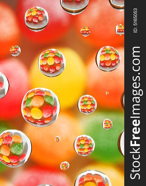 Abstract background, selective focus on candy reflected in droplets. Abstract background, selective focus on candy reflected in droplets