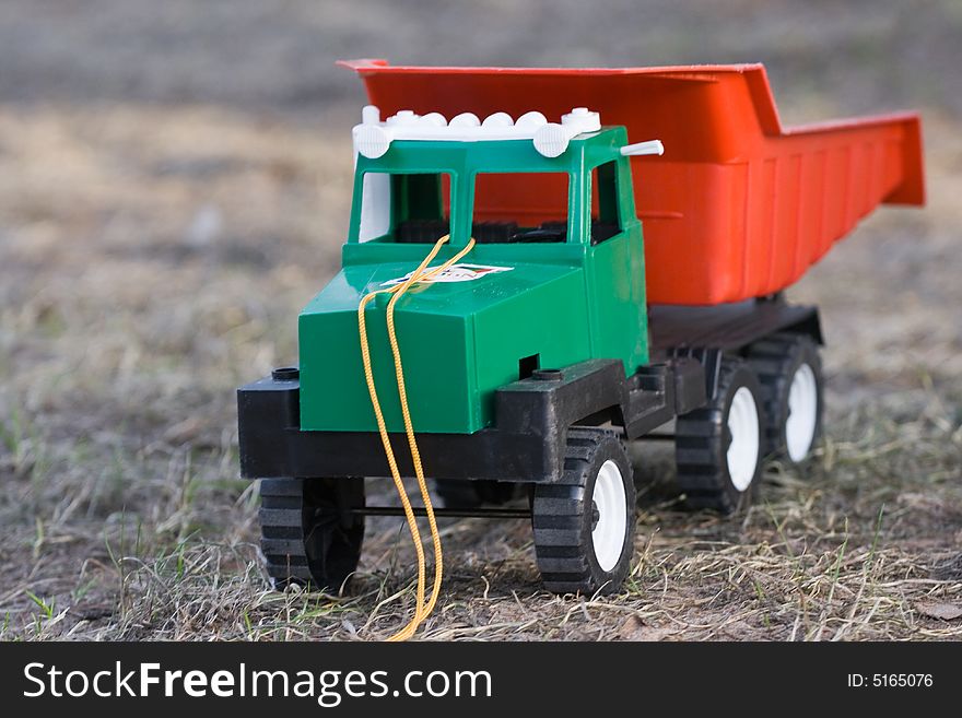 The toy lorry on a grass