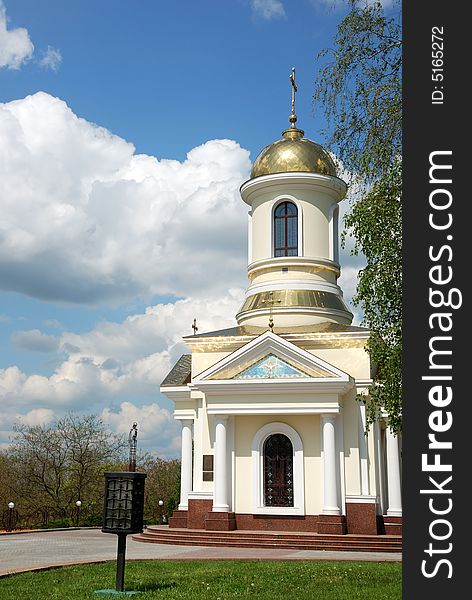 Small church over cloudy sky