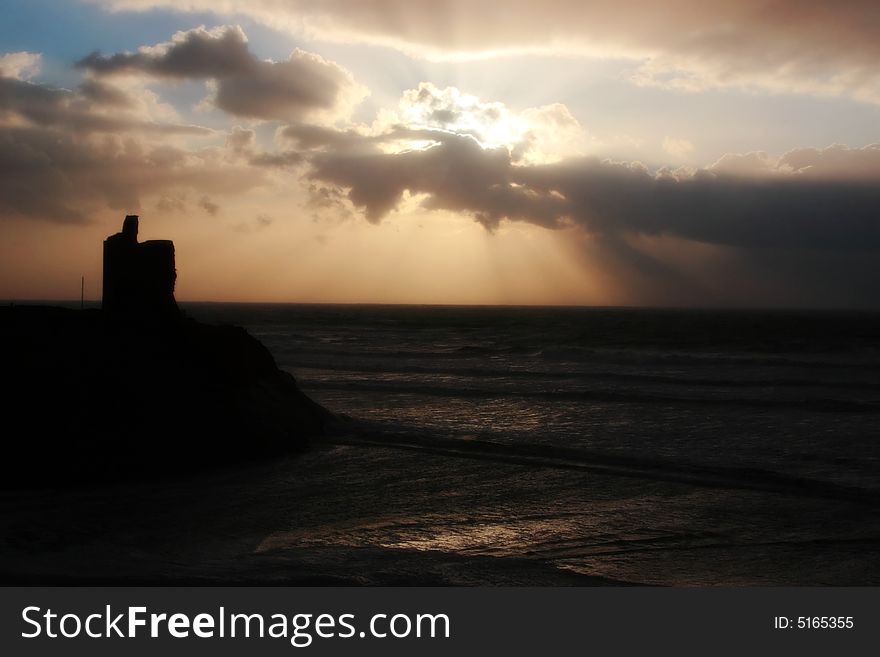 A castle in a west of ireland storm on its cliffs in ballybunion. A castle in a west of ireland storm on its cliffs in ballybunion