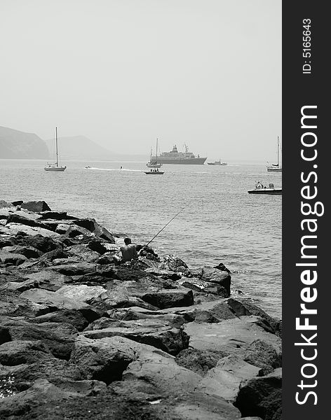 The photo is made on island Tenerife, in the foreground stones of a volcanic origin are visible, on a background the ship is visible  Lyubov Orlova . The photo is made on island Tenerife, in the foreground stones of a volcanic origin are visible, on a background the ship is visible  Lyubov Orlova