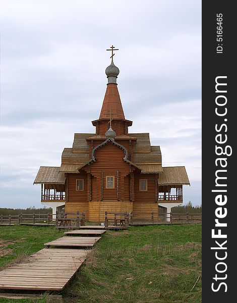 Small orthodox church from wood over blue sky. Small orthodox church from wood over blue sky
