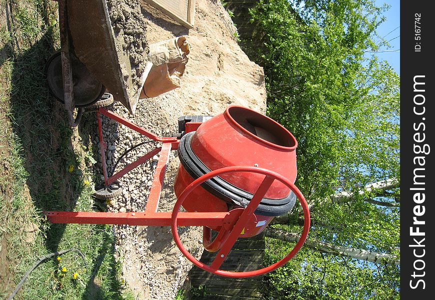 Red colored electric cement mixer, home use