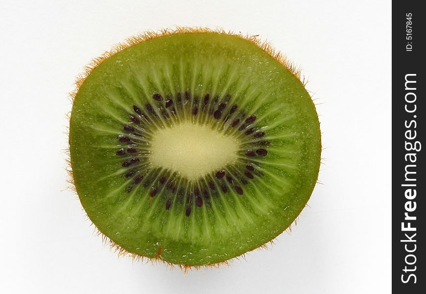 Still life of a kiwi section on a white background