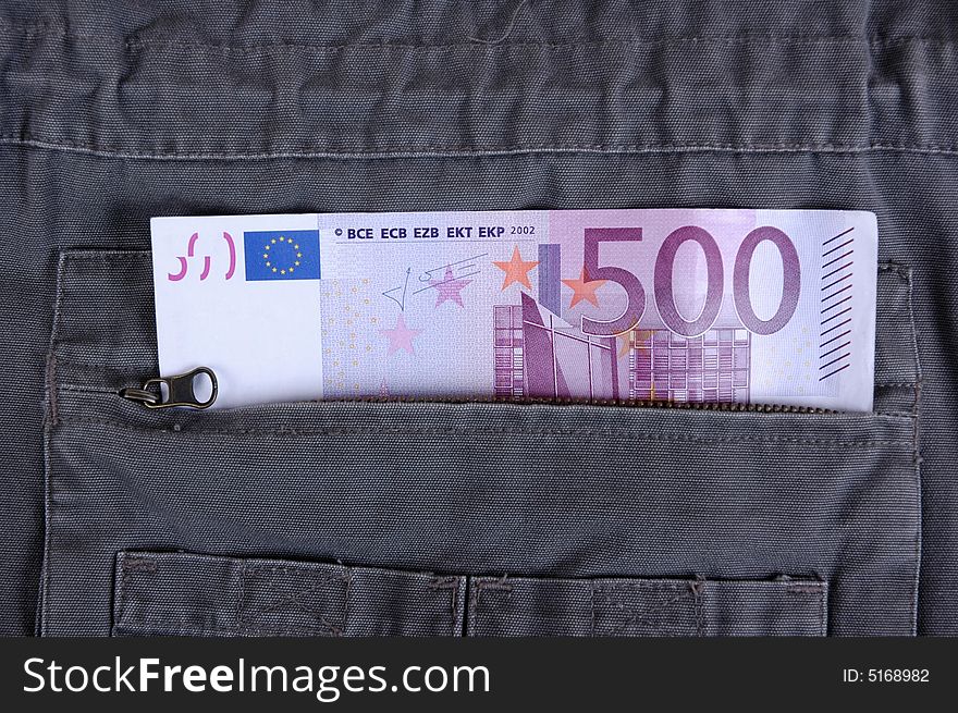 Euro in the pocket of a casual garment.  Photographed in a studio.