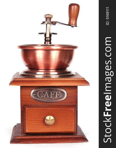 Old manual coffee grinder made of wood and metal