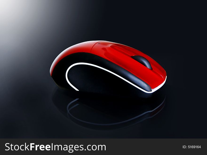 Red wireless mouse for a desktop computer