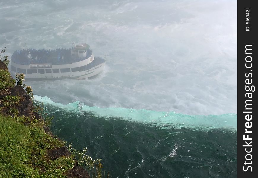 Niagara Falls, Ontario, Canada, Water edge with boat under the fall.