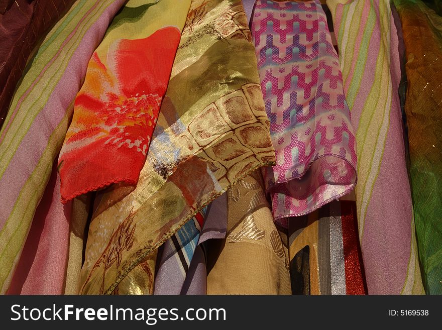 Assortment of colorful beautiful female scarfs and shawls. Assortment of colorful beautiful female scarfs and shawls
