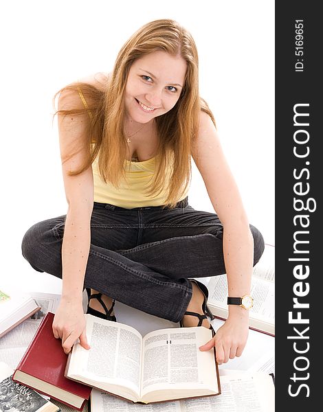 The young student with the books isolated on a white background